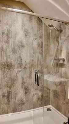a shower with a glass door in a bathroom at Rising Sun Inn - Kil Margh in Altarnun