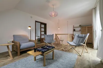 a living room with two chairs and a coffee table at Penn Cottage perfect for North Cornwall trips in Camelford