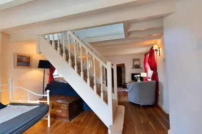 a bedroom with a staircase in a house at Finest Retreats - Forge Cottage, Padstow in Padstow