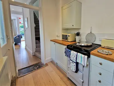 a kitchen with a stove and a counter top at The Bolthole in Fowey