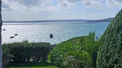a large body of water with boats in it at The Red House Annexe in Saint Mawes
