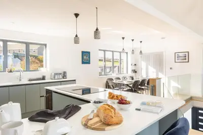 a kitchen with a table with a plate of food on it at 5 Bed in St. Ives oc-c28961 in Saint Ewe