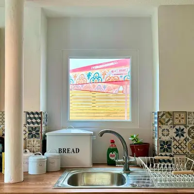 a kitchen counter with a sink and a window at Turtle retreat in Falmouth