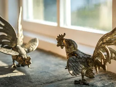 a group of statues of chickens on a window sill at Wharrastone - Uk50661 in Bude