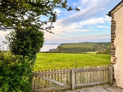 a view of a fence and a green field at Raddons - Uk50657 in Bude