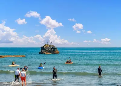 a group of people on kayaks in the ocean at Millendreath Beach Resort in Saint Martin