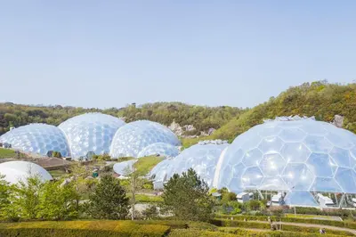 a group of domes in a field with trees at Landal Gwel an Mor in Portreath