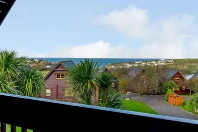 a view of the ocean from the balcony of a house at Landal Gwel an Mor in Portreath