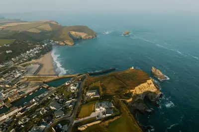 an aerial view of a beach and the ocean at Landal Gwel an Mor in Portreath