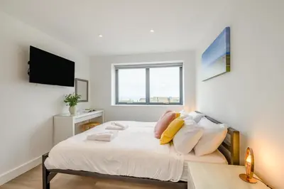 a bedroom with a bed with white sheets and pillows at 2 Bed in Tintagel oc-p33627 in Tintagel