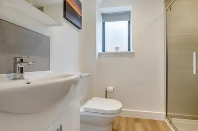 a white bathroom with a toilet and a sink at 2 Bed in Tintagel oc-p33627 in Tintagel
