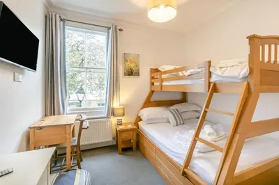 a dorm room with a bunk bed and a desk at 4 Bed in St. Ives oc-t33609 in St Ives