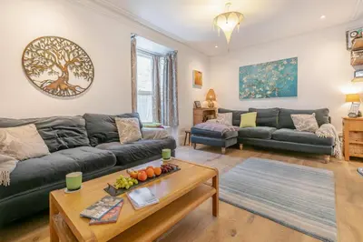 a living room with a couch and a table at 4 Bed in St. Ives oc-t33609 in St Ives