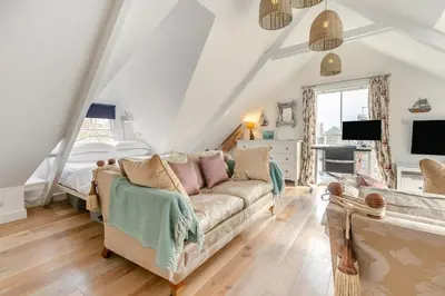 a living room with a couch and a bed at 4 Bed in St. Ives oc-t33609 in St Ives