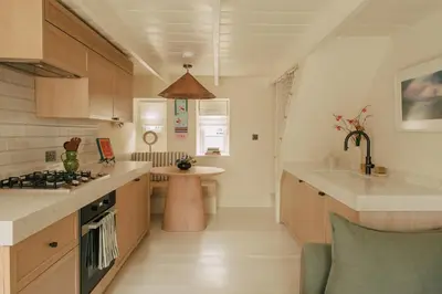 a kitchen with a sink and a counter top at Cozy Cottage in St Ives in St Ives