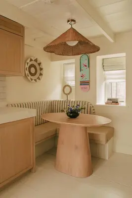 a kitchen with a table and a bowl of flowers on it at Cozy Cottage in St Ives in St Ives