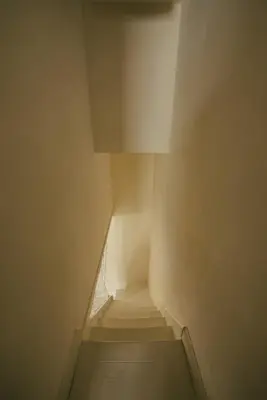 a staircase in a building with a stair case at Cozy Cottage in St Ives in St Ives