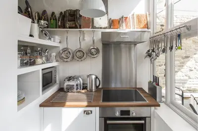 a kitchen with a sink and a counter top at Antonia's Pearls in St Austell