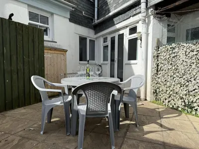 a table and chairs sitting on a patio at Pennys Place in St Ives