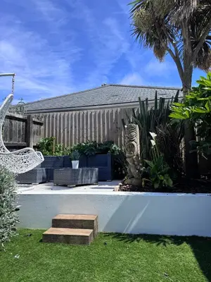 a house with a zebra statue in a yard at Boho Bali-style Beach House near Fistral in Newquay