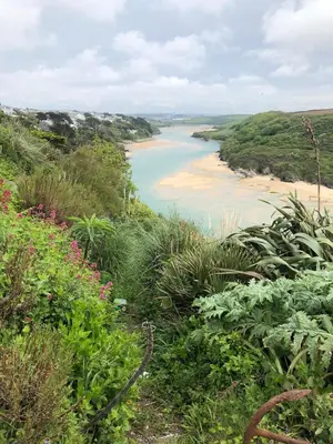 a view of a body of water with a beach at Entire Apartment in Pretty Coastal Village in Cubert