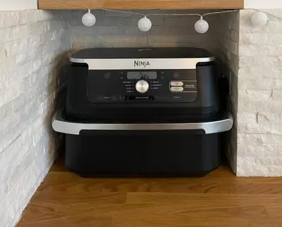 a microwave sitting on top of a toaster oven at Entire Apartment in Pretty Coastal Village in Cubert