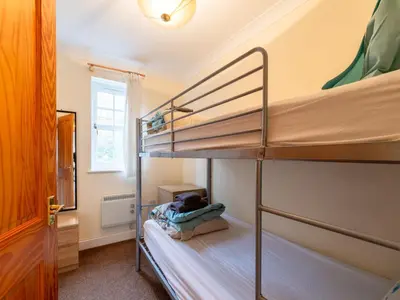 a bedroom with two bunk beds in a room at Holiday Home Porthilly by Interhome in Mevagissey