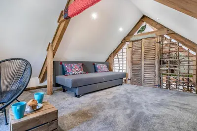 a living room with a couch in the attic at 1 Bed in Menheniot oc-t29268 in Menheniot
