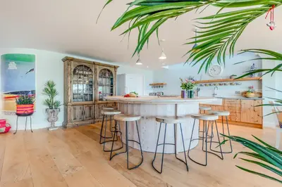a kitchen with a large island with bar stools at 5 Bed in Polzeath oc-r33648 in Polzeath