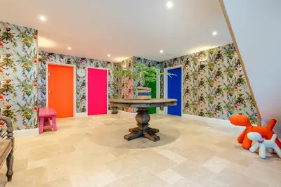a room with colorful walls and a table and a teddy bear at 5 Bed in Polzeath oc-r33648 in Polzeath
