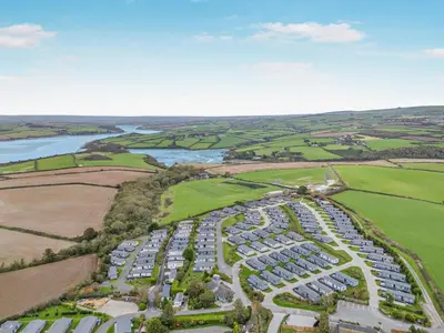 an aerial view of a parking lot next to a river at 3 Bed in Padstow oc-l33613 in Padstow