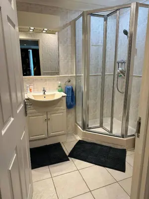 a bathroom with a shower and a sink at Dog Friendly Holiday Home in Newquay Cornwall in Newquay