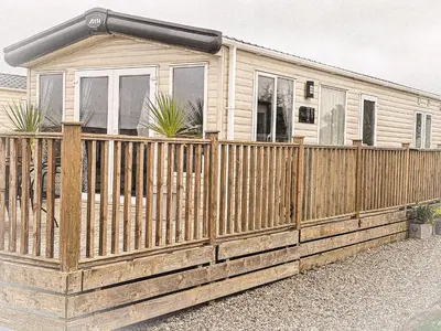 a wooden fence in front of a house at Cornish Dream in Truro