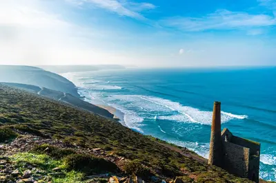 a view of the ocean from the top of a hill at Landal Leycroft Valley in Perranzabuloe
