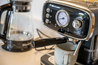 a coffee maker sitting on a counter with a cup at Skylark in Bodmin