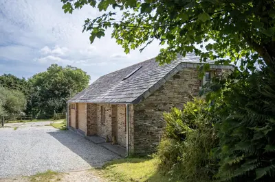 an old brick building with a roof at Skylark in Bodmin