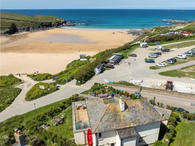 an aerial view of a beach and the ocean at Sunset Sands in St Merryn