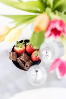 a plate of chocolate and strawberries on a table at Tranquil Shores in Carbis Bay