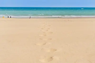 a couple of footprints in the sand on a beach at Tranquil Shores in Carbis Bay