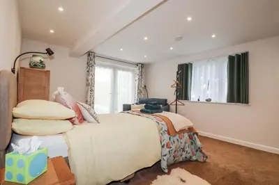 a bedroom with a bed and a window at Hilbre in Padstow