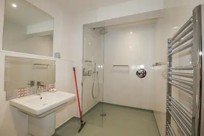 a bathroom with a sink and a shower at Hilbre in Padstow