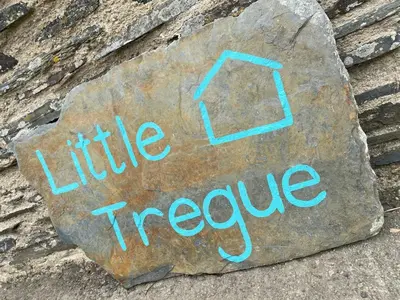 a sign that says little treeile on a rock at Little Tregue in Camelford