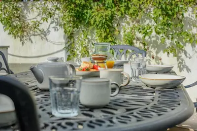 a black table with a tea set on it at 3 Bed in Padstow oc-f33036 in Padstow