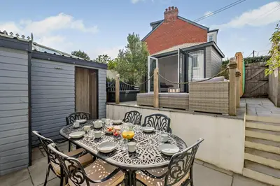 a table and chairs on the patio of a house at 3 Bed in Padstow oc-f33036 in Padstow