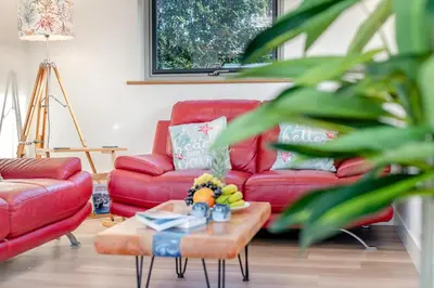a living room with red couches and a coffee table at 2 Bed in Crackington Haven oc-h33817 in Crackington Haven
