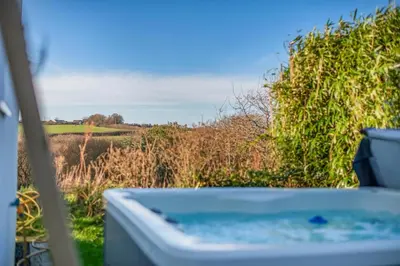 a bath tub with a view of a field at 2 Bed in Crackington Haven oc-h33817 in Crackington Haven