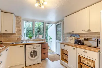 a kitchen with a washer and dryer in it at 2 Bed in St. Ives oc-g33644 in St Ives