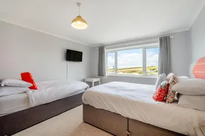 a bedroom with two beds and a window at 5 Bed in Newquay oc-c33035 in Newquay