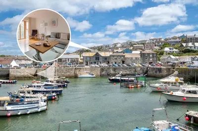 a group of boats docked in a harbor at 2 Bed in Porthleven oc-p00890 in Porthleven