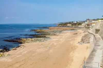 a view of a beach next to the ocean at 2 Bed in Porthleven oc-p00890 in Porthleven